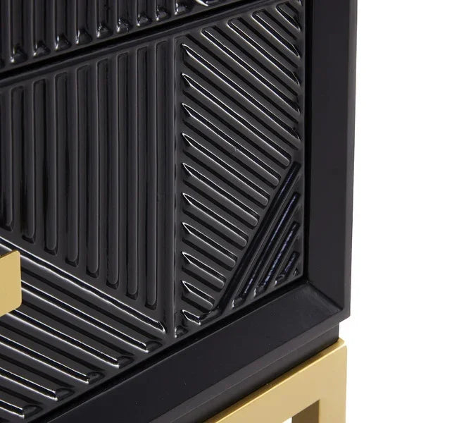 Black cabinet with geometric textured wood front and gold metal leg detail