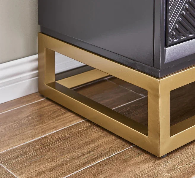 Black sideboard with gold metal frame and geometric detail on wood flooring