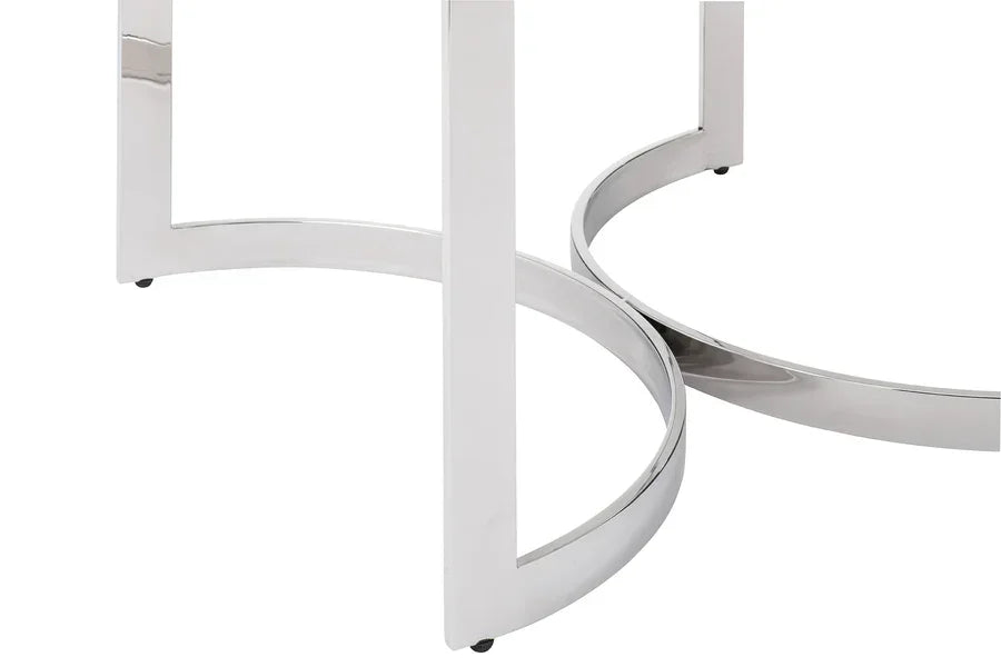 Chrome metal legs and round base detail on contemporary furniture table