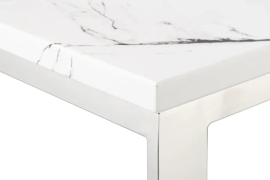 Marble dining table corner with white and grey veined top and chrome metal legs