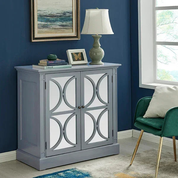 Grey mirrored sideboard cabinet with geometric doors in modern living room setting