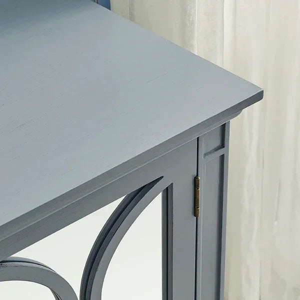 Grey wooden sideboard cabinet corner with mirrored door and decorative trim