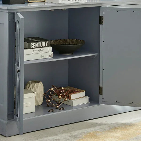 Blue wooden sideboard cabinet open to reveal shelves with decor, books, and storage boxes