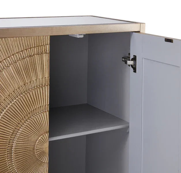 Gold sunburst cabinet door with open shelving and grey interior