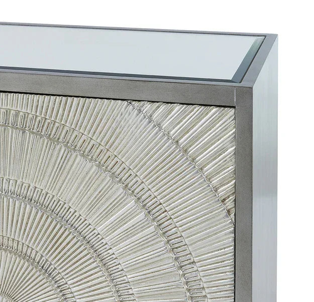 Silver console table with glass top and textured geometric front panel detail