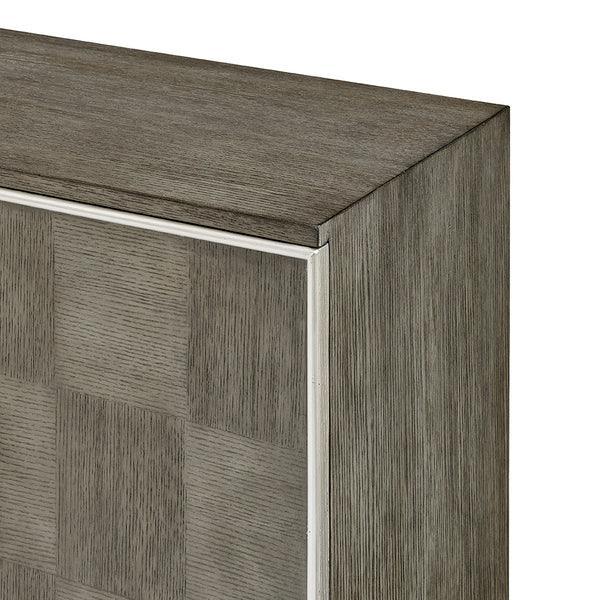 Close up of grey wood cabinet corner with subtle checkerboard panel detail