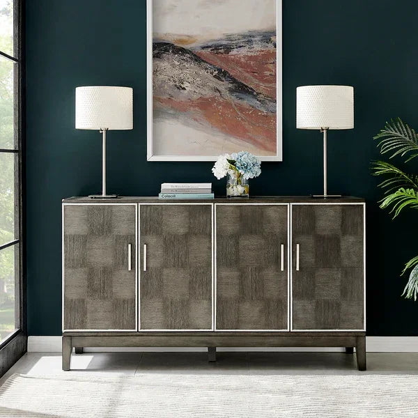 Modern grey sideboard cabinet with four doors, two table lamps, and contemporary decor