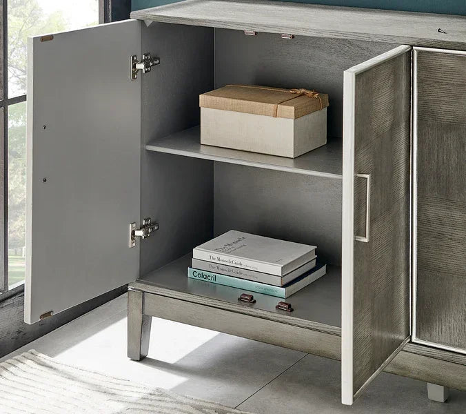 Grey wood sideboard cabinet with open doors, books and box on shelves