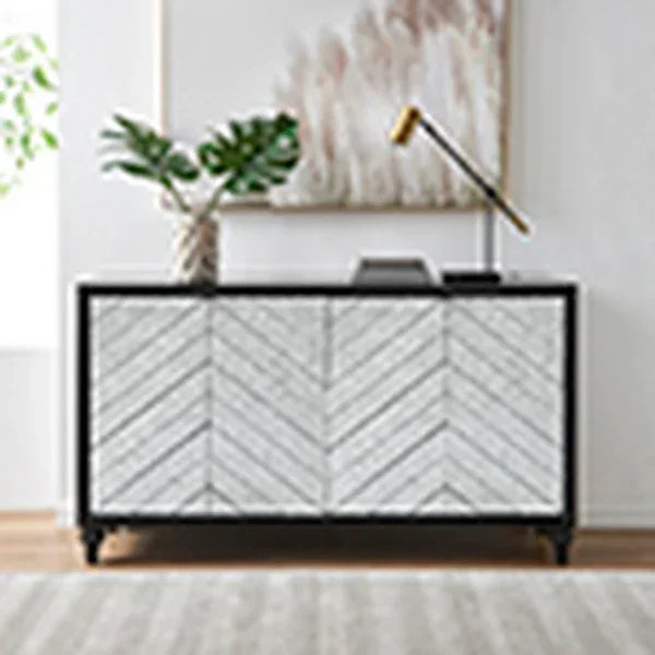 Chevron pattern sideboard with black frame, gold lamp and plant decor in modern living room