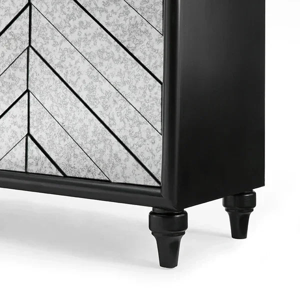 Black and mirrored chest of drawers with chevron pattern and turned legs