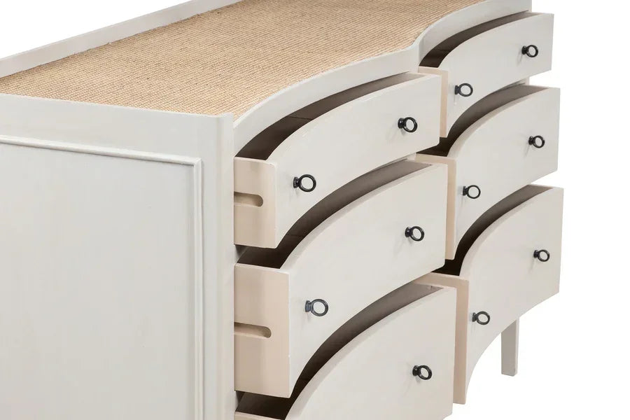 Curved cream chest of drawers with six open drawers and black metal handles