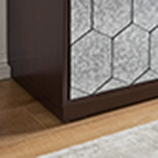 Dark wood cabinet with geometric mirrored panel on hardwood floor