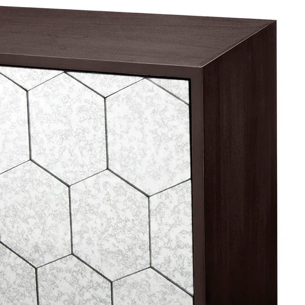 Dark wood cabinet with hexagonal mirrored panel design on the front
