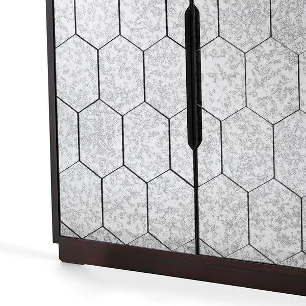 Mirrored cabinet door with hexagon pattern and black wood frame