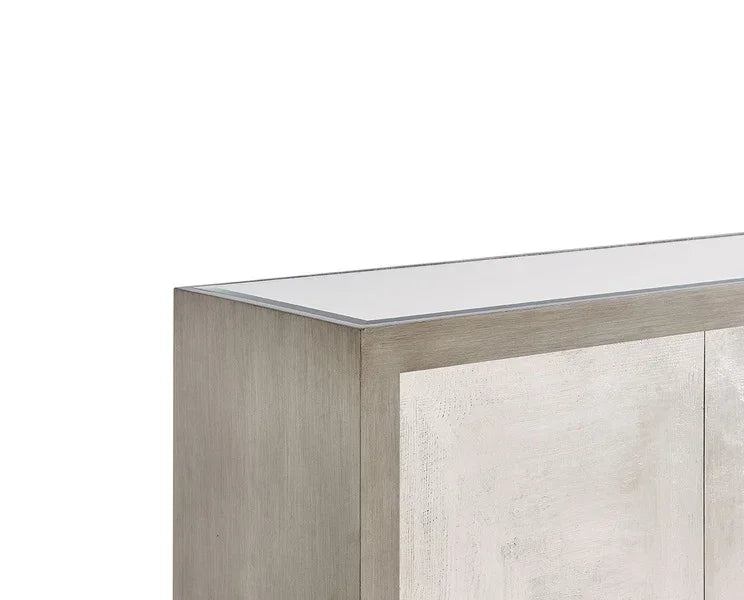 Light wood sideboard with textured doors and a glass top, front and side angle