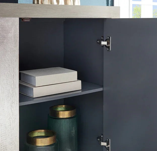 Interior of modern grey storage cabinet with shelves, decorative boxes and green glass vases