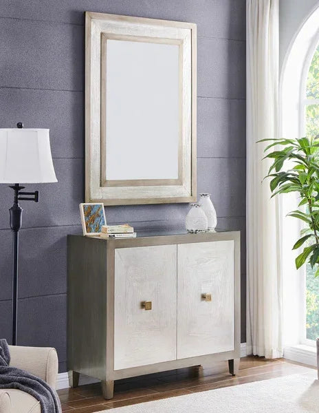 Modern sideboard cabinet with square handles, styled with books and decor, silver framed mirror