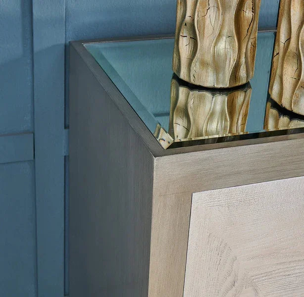 Light oak bedside table with glass top and sculpted decorative vases