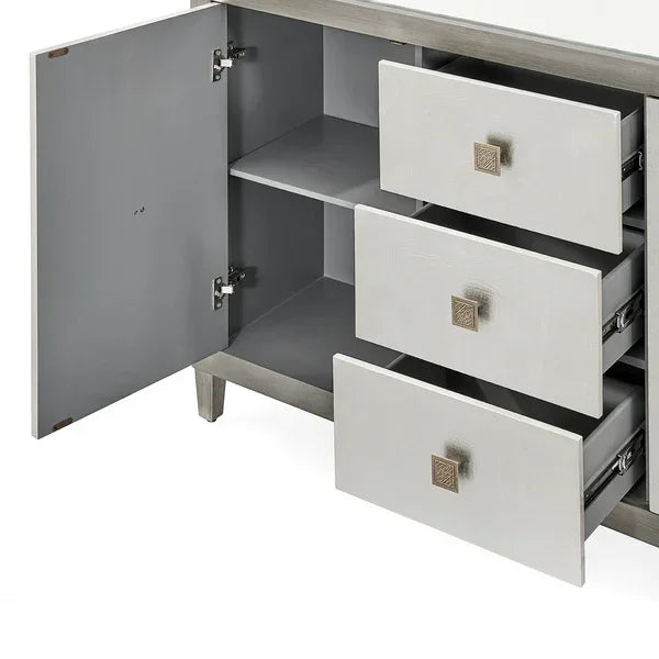 Modern sideboard cabinet with three open drawers and one open door showing storage shelves
