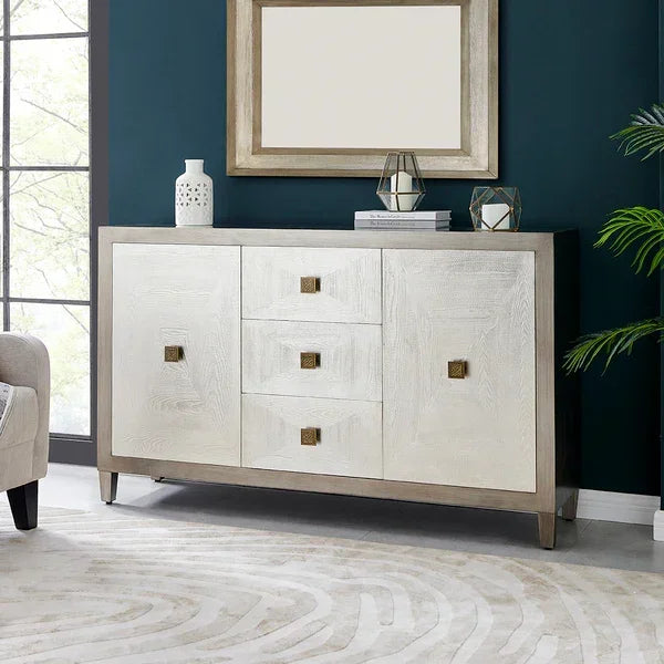 Modern two-tone sideboard with gold handles, three drawers, two cabinets, and decorative accents