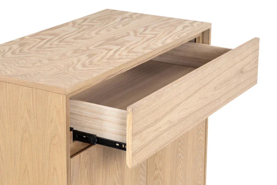 Light wood chest of drawers with open top drawer showing smooth sliding mechanism