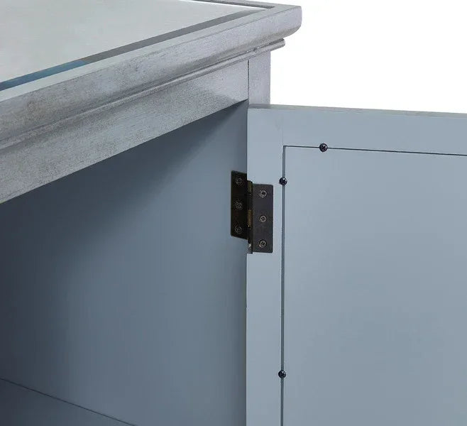 Close-up of blue wooden cabinet door with visible hinge and smooth painted finish