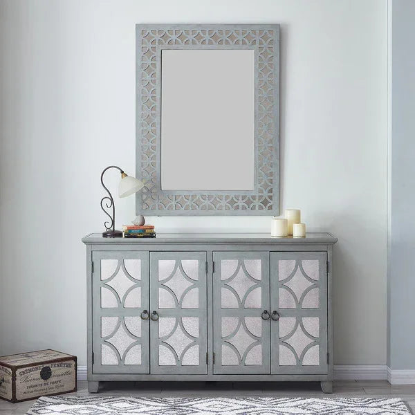 Grey mirrored sideboard with decorative cabinet doors and matching wall mirror in hallway