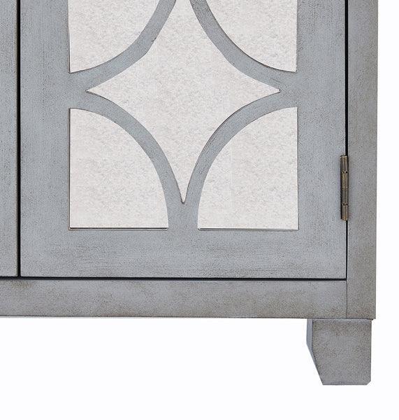 Grey wooden cabinet door with geometric panel and visible hinge