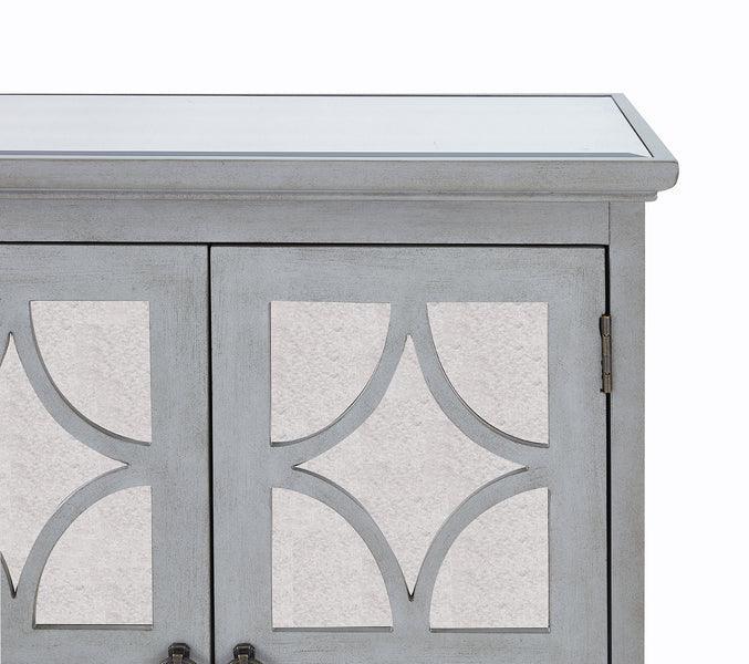Grey wooden cabinet with mirrored geometric door panels and a glass top