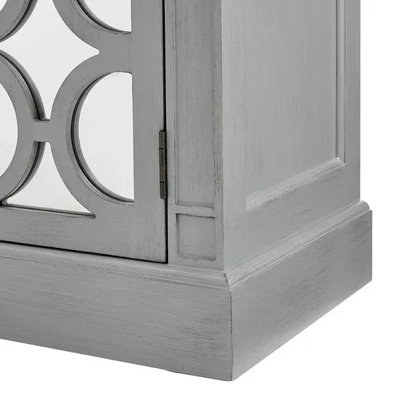 Grey wooden cabinet base with mirrored panel and decorative circular detailing