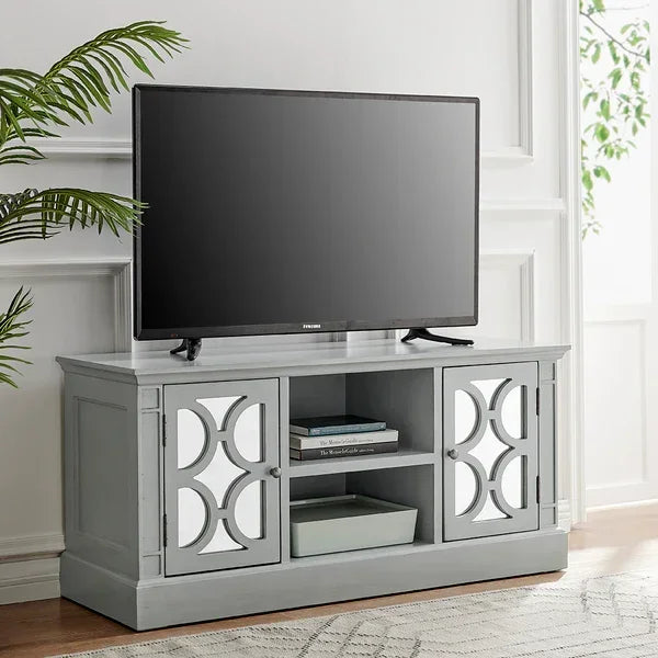 Grey TV unit with mirrored cabinet doors and open shelf styling in a bright living room
