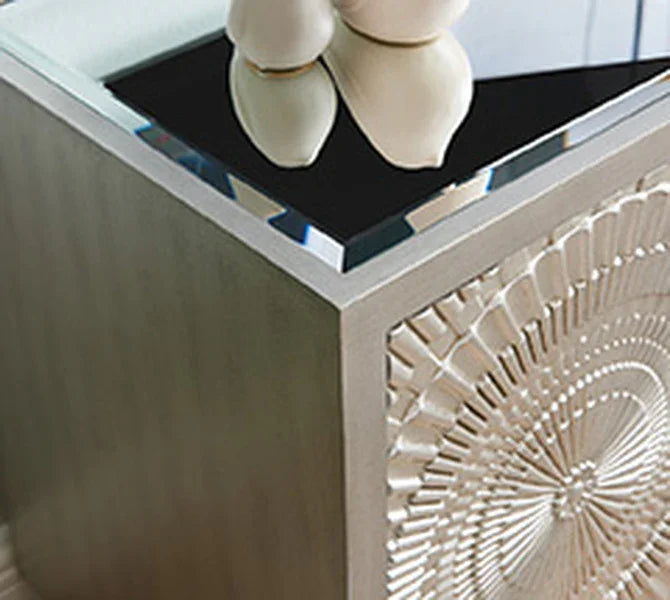 Modern side table with carved wood detail and mirrored glass top
