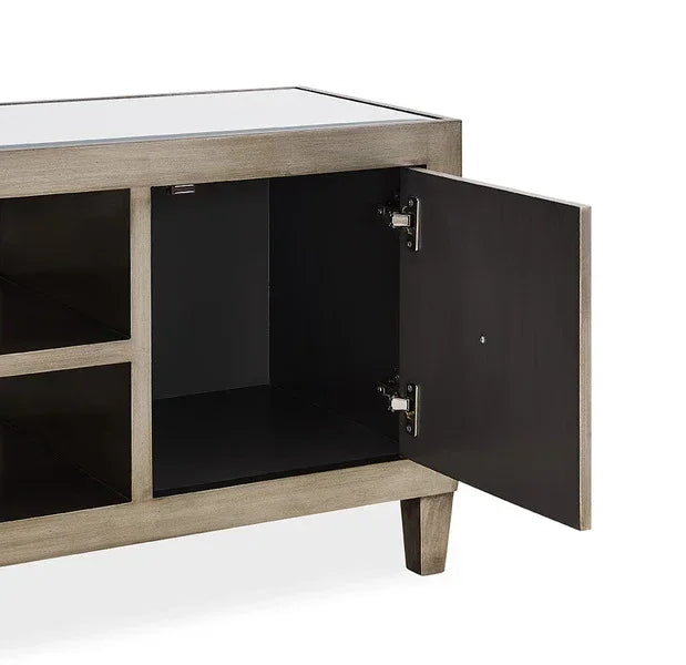 Close-up of grey wood TV unit with cabinet door open