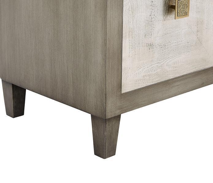 Closeup of wooden sideboard leg with brushed grey finish and textured cabinet panel
