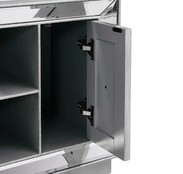 Silver mirrored cabinet with open door showing interior storage shelves