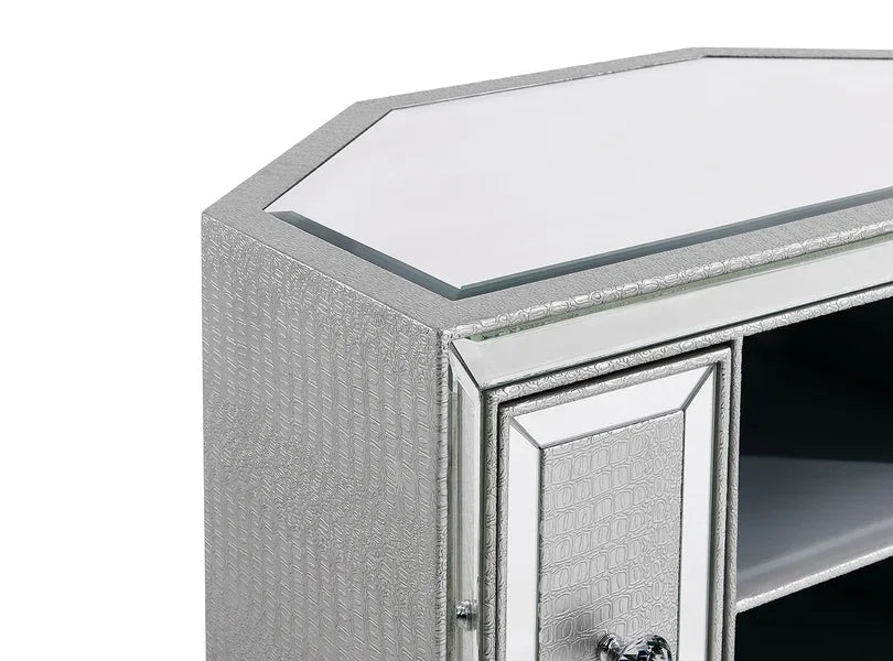 Silver mirrored cabinet corner with textured pattern and glass top panel