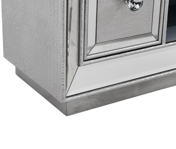 Close-up of silver mirrored sideboard with textured finish and crystal drawer handle