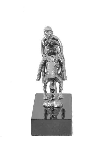 Silver horse and rider ornament on black rectangular base, front view