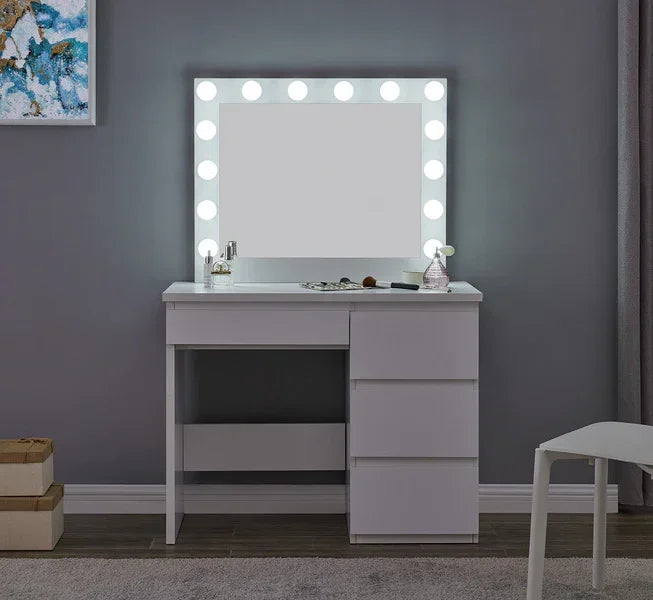 White vanity table with LED mirror and drawers against grey wall