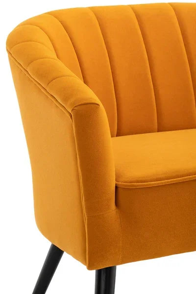 Mustard yellow accent chair with curved backrest and vertical stitched upholstery