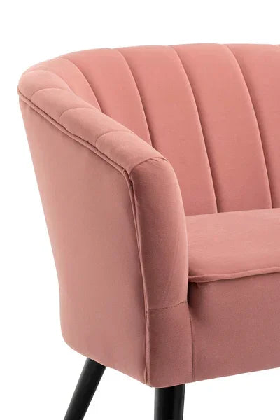 Blush pink accent chair with channel tufted backrest and black angled legs