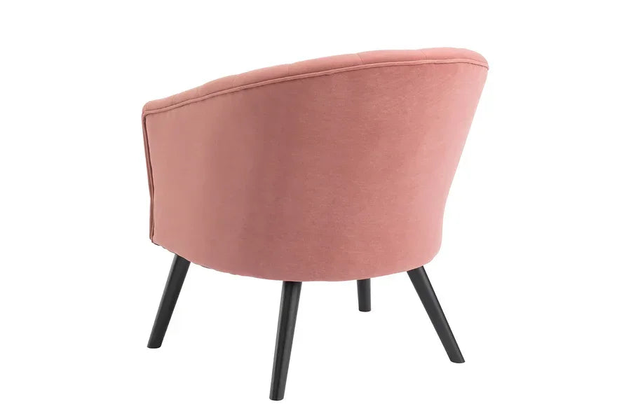 Back view of blush pink fabric armchair with black angled legs