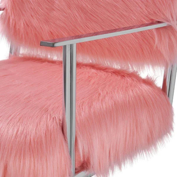 Closeup of pink faux fur armchair with chrome frame