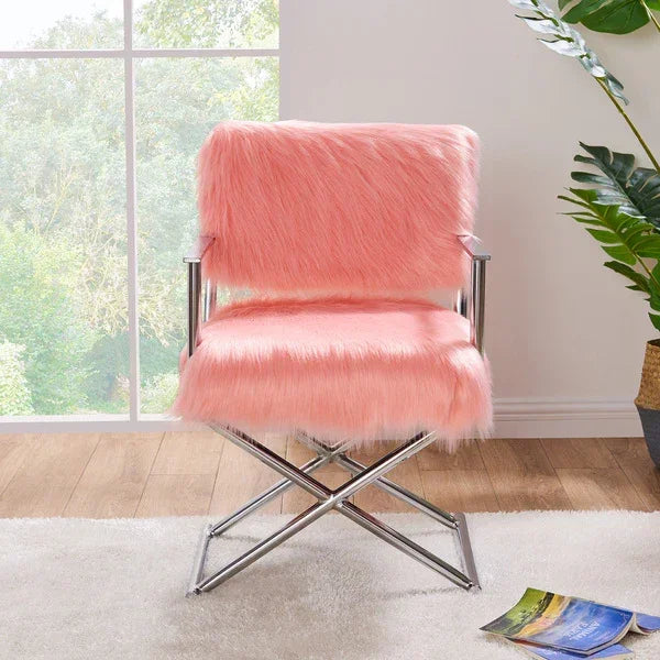 Pink faux fur accent chair with chrome frame on wood floor near large window
