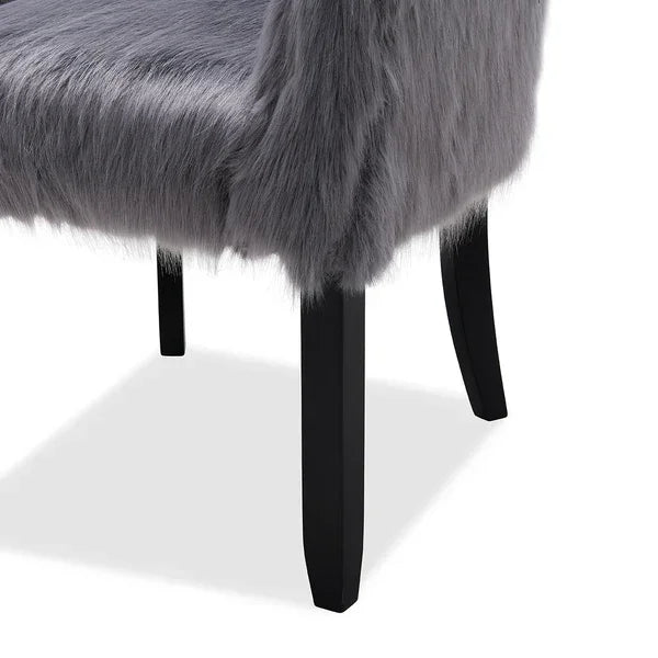 Grey faux fur dining chair with black wooden legs, side angle view highlighting texture