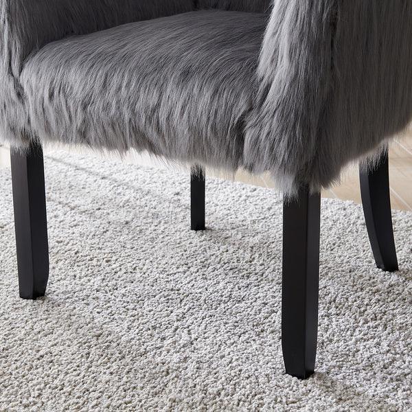 Grey faux fur accent chair with black wood legs on textured cream rug
