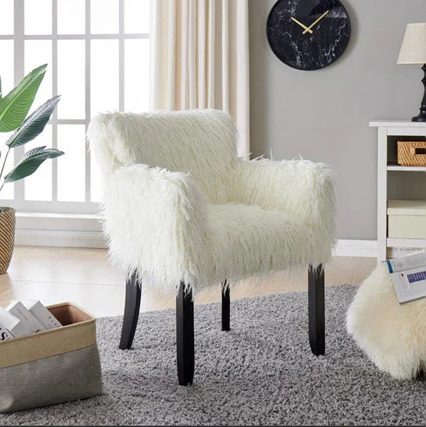 White faux fur accent chair with black wooden legs in modern living room setting