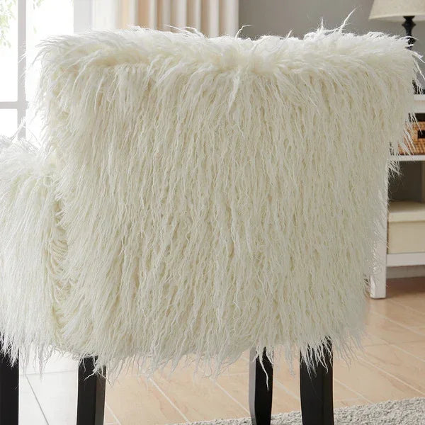 White faux fur accent chair with black legs in a modern living room