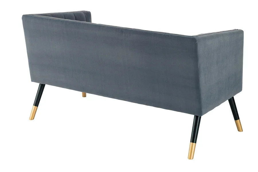 Grey velvet sofa rear view with black and gold tapered legs