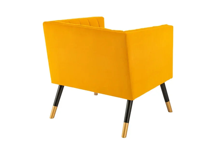 Yellow fabric armchair with gold-tipped black legs shown from back angle